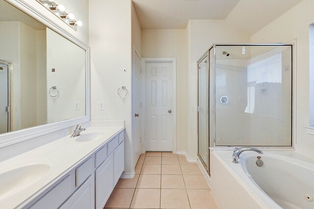 bathroom featuring tile patterned flooring, vanity, and plus walk in shower