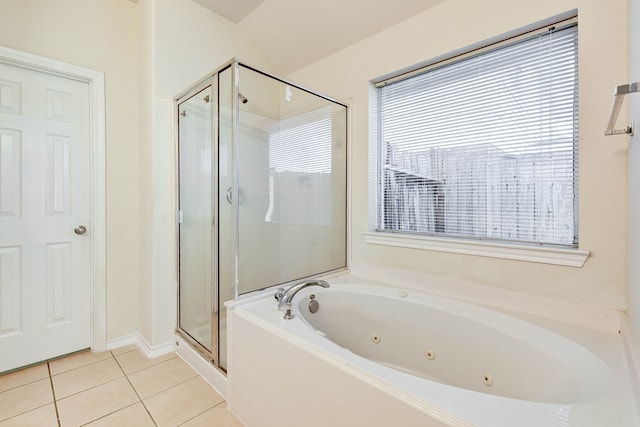 bathroom with tile patterned flooring and separate shower and tub