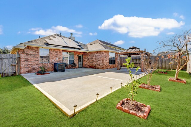 exterior space with a gazebo, a lawn, a patio, and solar panels