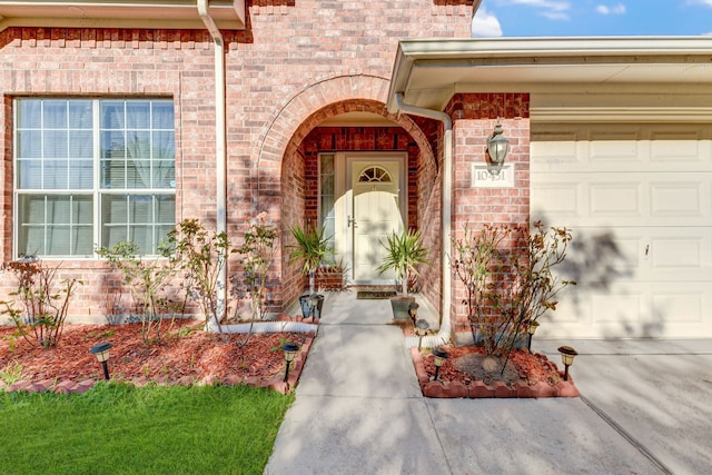 view of exterior entry featuring a garage