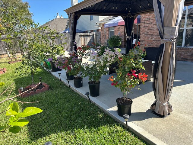 view of yard with a gazebo and a patio