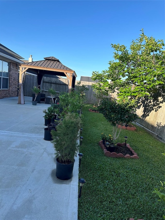 view of yard with a gazebo and a patio area