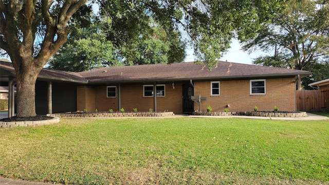 rear view of property with a yard