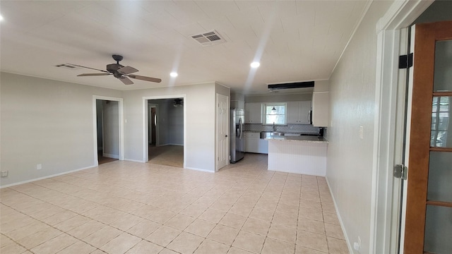 interior space featuring ceiling fan