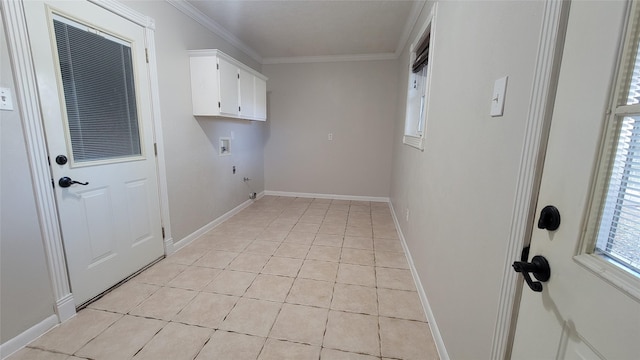 laundry room with light tile patterned floors, cabinets, ornamental molding, and hookup for a washing machine