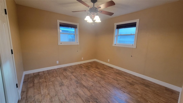 unfurnished room with light wood-type flooring, plenty of natural light, and ceiling fan