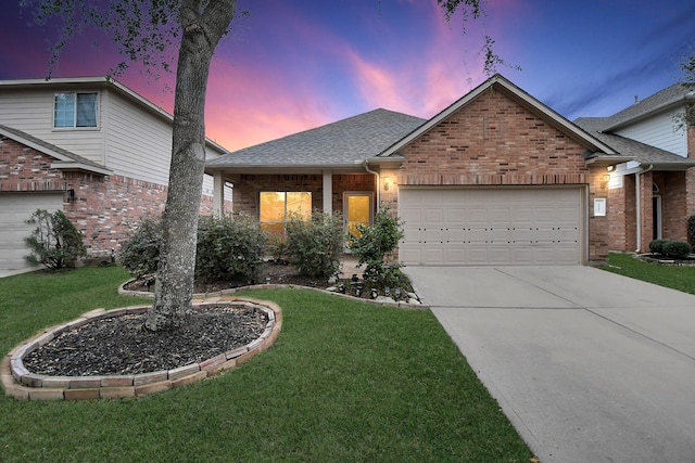 view of front of house with a lawn and a garage