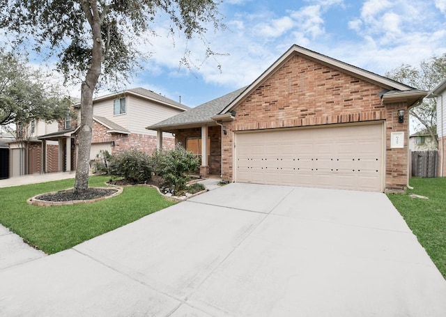 view of front of house with a front lawn and a garage