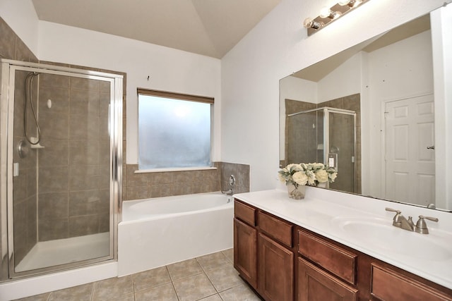 bathroom with tile patterned flooring, vanity, lofted ceiling, and shower with separate bathtub