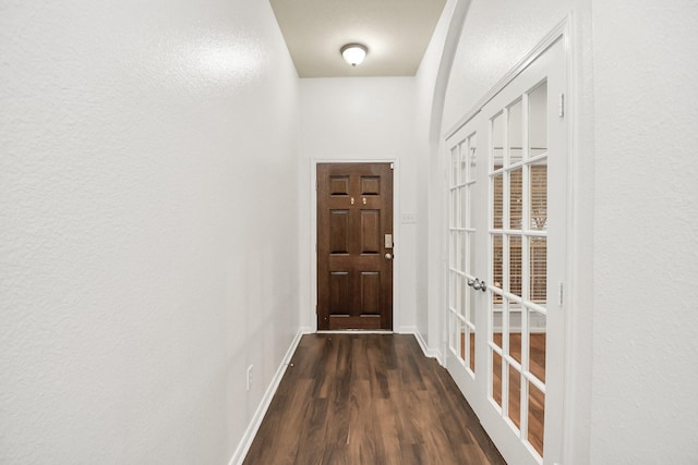 doorway to outside with dark hardwood / wood-style flooring