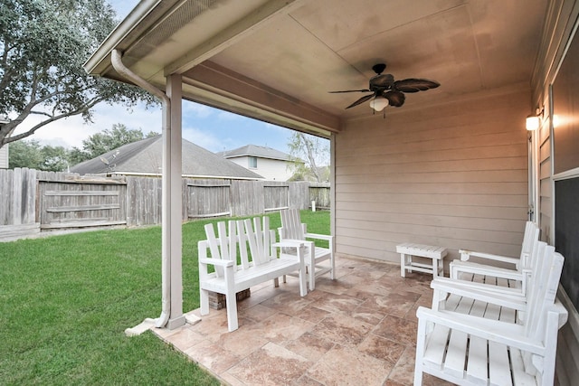 view of patio featuring ceiling fan