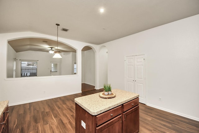 kitchen featuring dark hardwood / wood-style floors and a center island