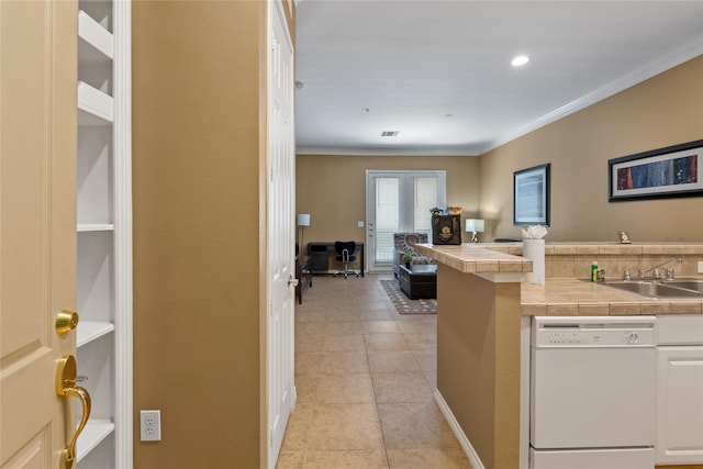 kitchen with white cabinetry, sink, tile countertops, white dishwasher, and ornamental molding