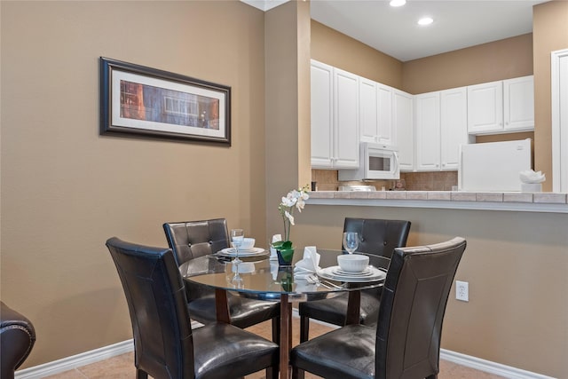 view of tiled dining space