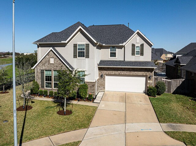 view of front facade featuring a garage and a front yard