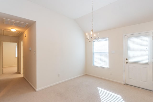 unfurnished dining area with a chandelier, light colored carpet, and vaulted ceiling