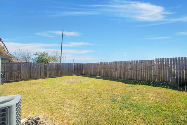 view of yard with central air condition unit