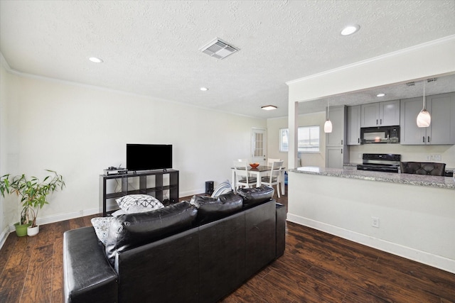 living room featuring ornamental molding, a textured ceiling, and dark wood-type flooring