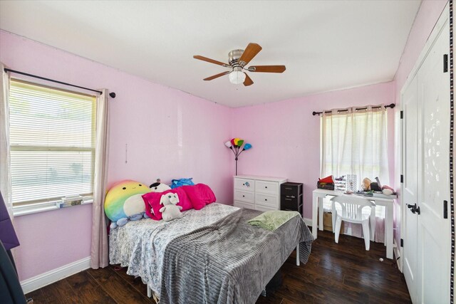 bedroom featuring dark hardwood / wood-style floors and ceiling fan