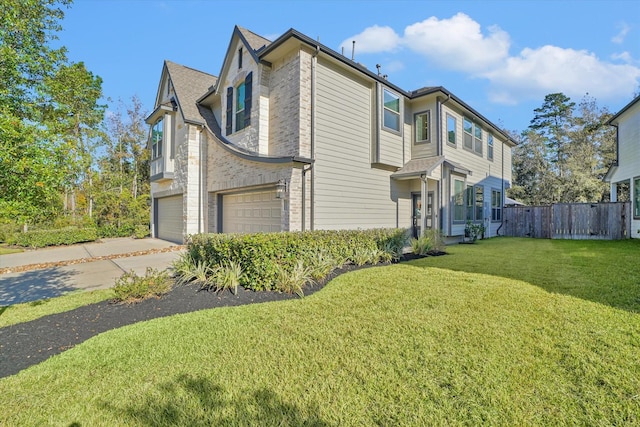 view of front of home featuring a garage and a front lawn