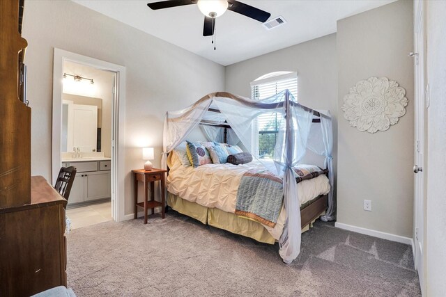 bedroom featuring carpet flooring, connected bathroom, ceiling fan, and sink