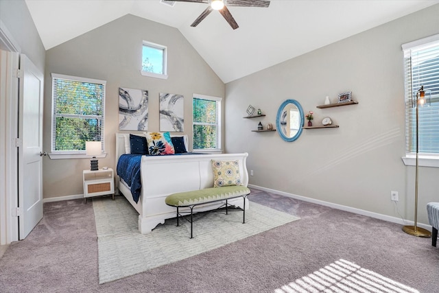 bedroom featuring ceiling fan, light colored carpet, and vaulted ceiling