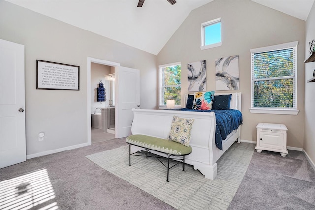 bedroom with ensuite bath, ceiling fan, high vaulted ceiling, and light carpet