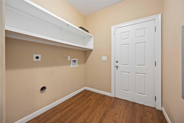 clothes washing area featuring electric dryer hookup, gas dryer hookup, hookup for a washing machine, and wood-type flooring