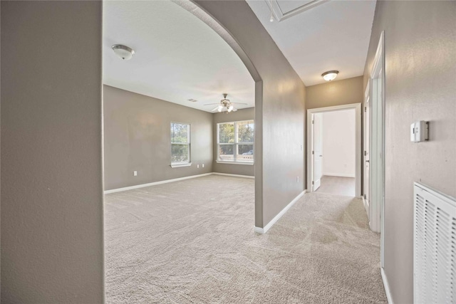 hallway featuring light carpet