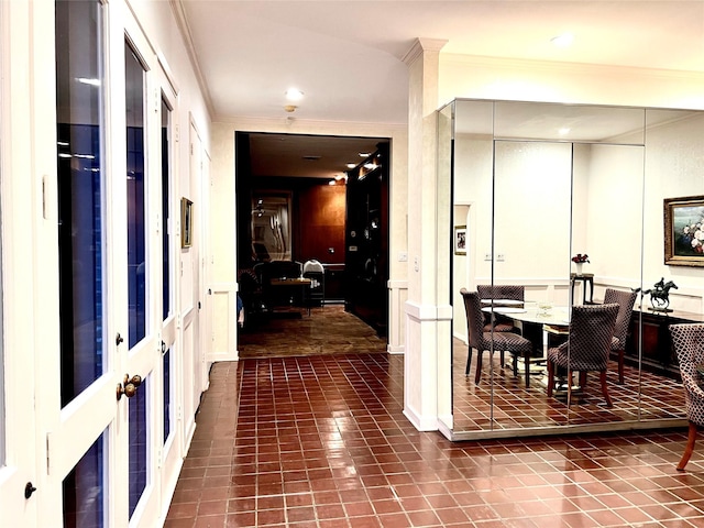 interior space featuring french doors and ornamental molding