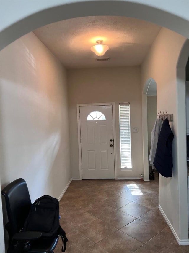 entryway featuring tile patterned flooring