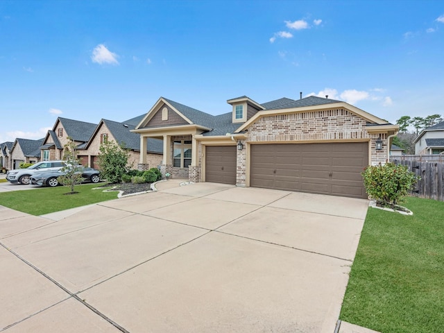 view of front of property featuring a garage and a front lawn