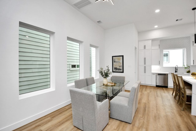 dining area featuring light wood-type flooring