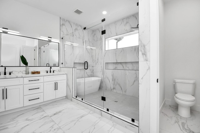 full bathroom featuring vanity, separate shower and tub, and toilet