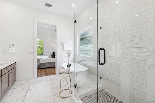 bathroom with vanity and plus walk in shower