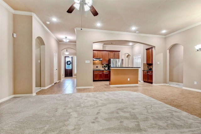 unfurnished living room with ornamental molding, ceiling fan, and light tile patterned flooring