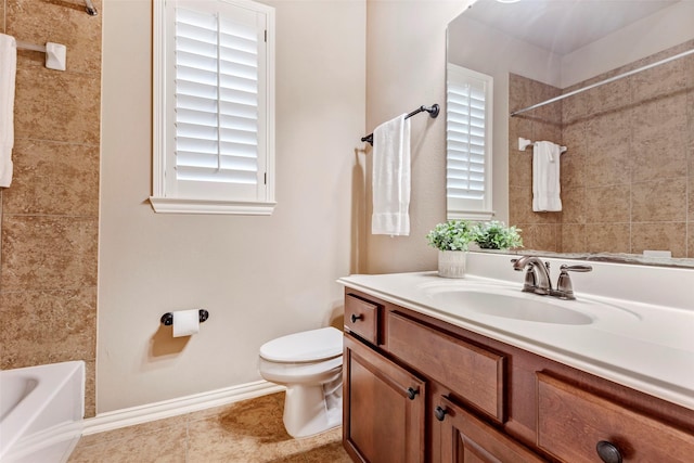 full bathroom with toilet, vanity, and tiled shower / bath