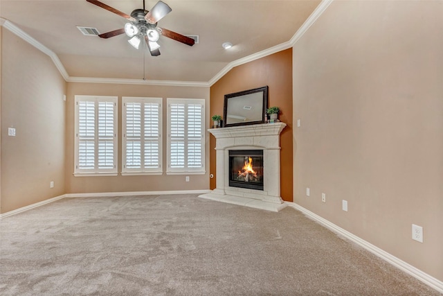 unfurnished living room with ceiling fan, light colored carpet, ornamental molding, and vaulted ceiling