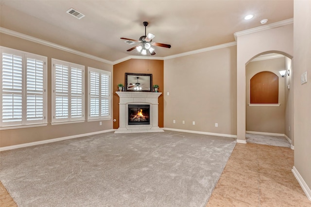 unfurnished living room featuring lofted ceiling, ceiling fan, crown molding, and light carpet