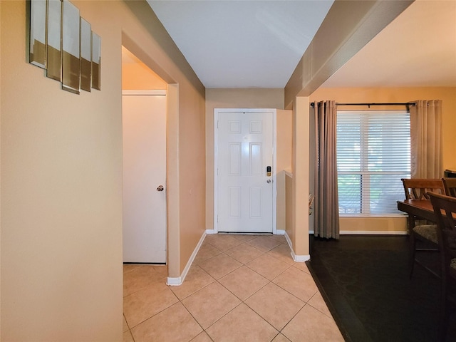 foyer entrance with light tile patterned floors