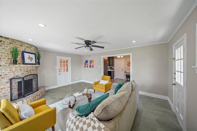 living room featuring ceiling fan, ornamental molding, and a brick fireplace