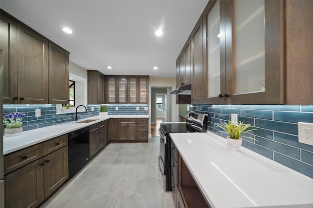 kitchen with dishwasher, sink, electric stove, decorative backsplash, and dark brown cabinets