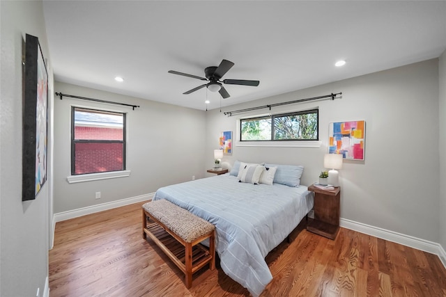 bedroom with ceiling fan and wood-type flooring