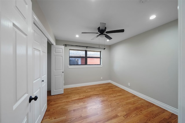 unfurnished bedroom featuring light wood-type flooring and ceiling fan