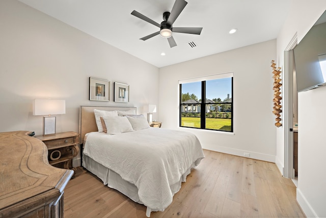 bedroom featuring light hardwood / wood-style flooring and ceiling fan