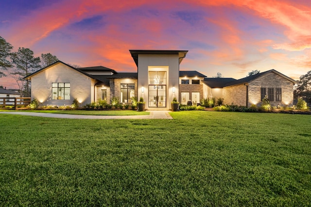 view of front of property with a lawn