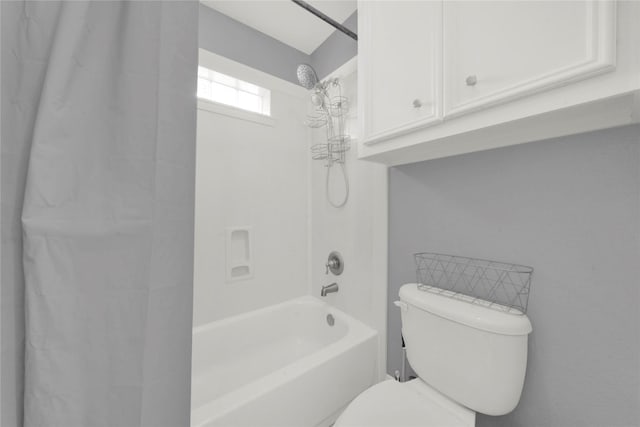 bathroom featuring toilet and shower / washtub combination