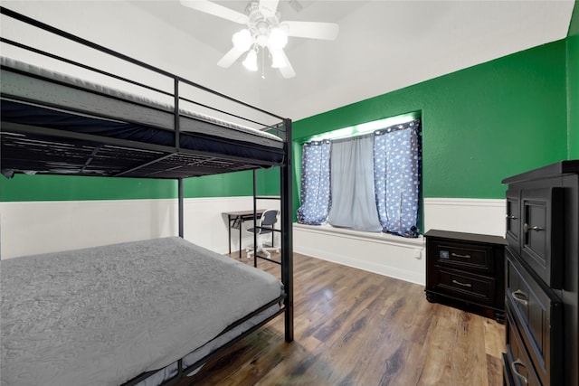 bedroom featuring hardwood / wood-style floors and ceiling fan