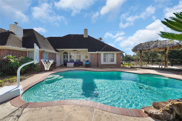 view of swimming pool with a gazebo, a patio area, and an outdoor living space