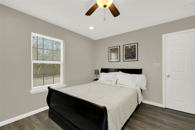 bedroom featuring dark hardwood / wood-style flooring and ceiling fan